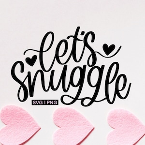 May include: Black and white graphic with the text "Let's snuggle" in a cursive font. There are three small hearts above and below the text. The graphic is on a white background.