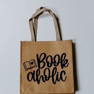 May include: A brown paper tote bag with black handles and the text "Bookaholic" with a small book and heart graphic.