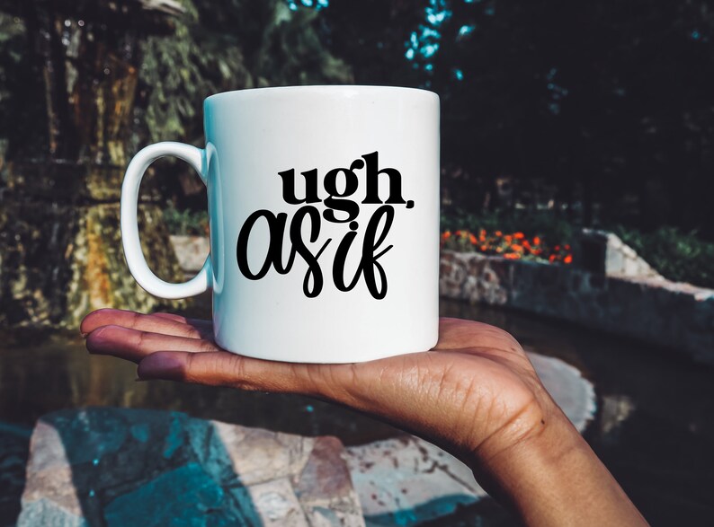 May include: White ceramic mug with black text that reads "ugh. as if".