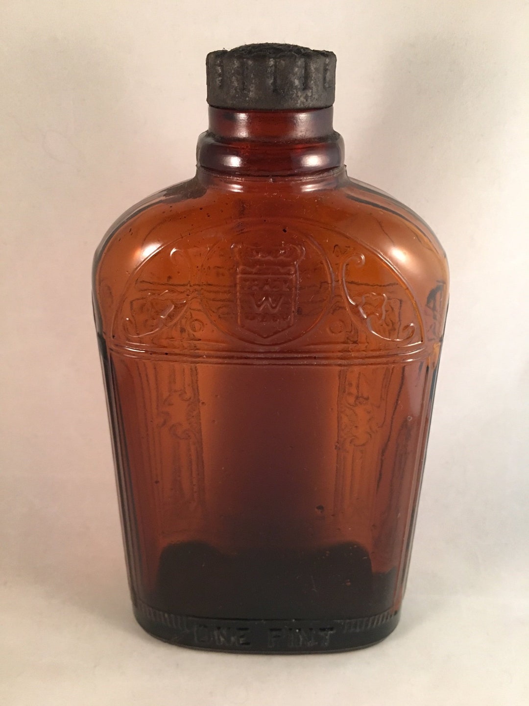 Vintage One Pint Amber Glass Whiskey Bottlescroll and Column Design