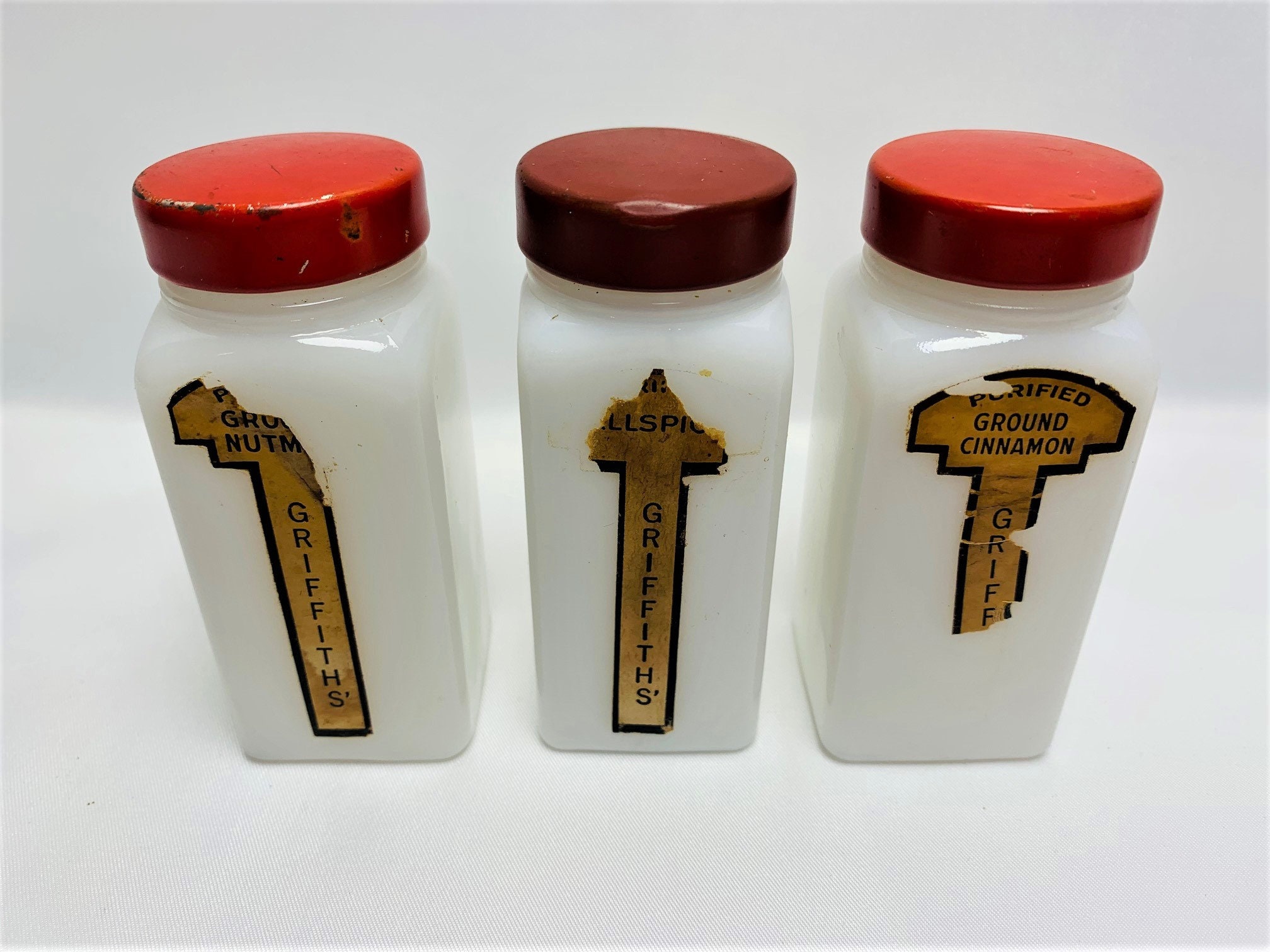 Griffiths' Red Capped Milk Glass Spice Jars With Wooden Rack