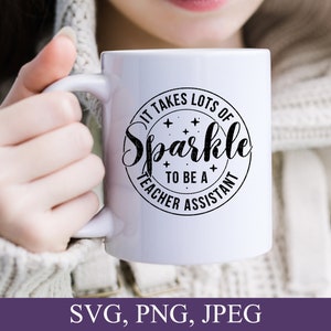 May include: White ceramic mug with a black circle design that says "It takes lots of sparkle to be a teacher assistant".