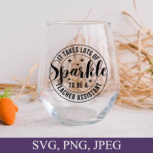 May include: A clear glass wine glass with a black and white design that says "It takes lots of sparkle to be a teacher assistant".