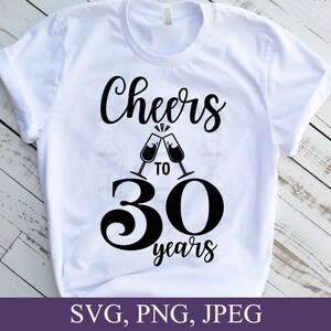 May include: White t-shirt with the words "Cheers to 30 years" in black script. The design includes two champagne glasses clinking together above the number 30. The bottom of the image shows the text "SVG, PNG, JPEG".