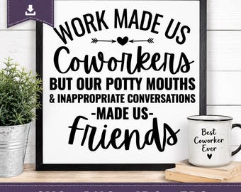 May include: A square black-framed sign with white background and black text reading: WORK MADE US Coworkers BUT OUR POTTY MOUTHS & INAPPROPRIATE CONVERSATIONS -MADE US- friends. A small white mug with black text Best Coworker Ever sits nearby.