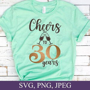 May include: A mint green t-shirt with the words "Cheers to 30 years" in brown and gold lettering. The design includes two champagne glasses clinking together. The bottom of the shirt has the file types: SVG, PNG, JPEG.