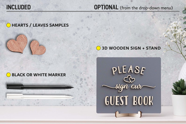May include: A wooden sign with the text "PLEASE sign our GUEST BOOK" in white letters on a grey background. The sign is on a stand and includes two small wooden hearts. The sign is accompanied by a black and white marker and two wooden hearts.