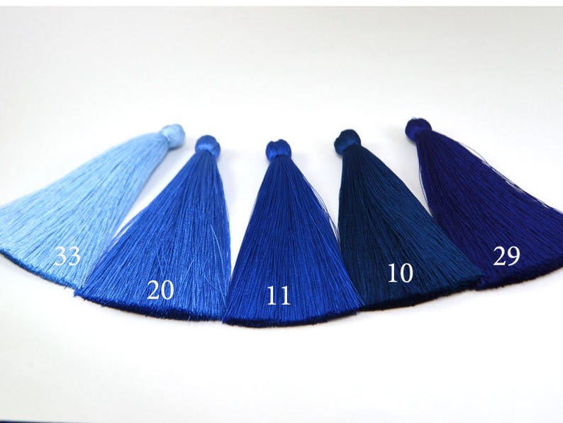 May include: Six different shades of blue tassel trim, ranging from light blue to dark blue. The tassels are labeled with numbers: 33, 20, 11, 10, and 29.