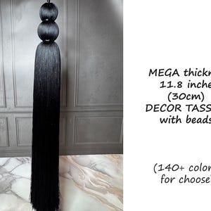 May include: Black decor tassel with beads. The tassel is 11.8 inches (30cm) thick. The image includes the text "MEGA thickness 11.8 inches (30cm) DECOR TASSELS with beads (140+ colors for choose)".