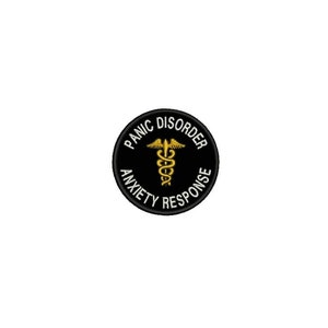 May include: Black and white round patch with the text "Panic Disorder Anxiety Response" in white lettering around a gold medical symbol.