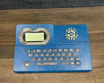 Gioco elettronico portatile vintage Ruota della Fortuna Mattel del 1988, testato e funzionante.