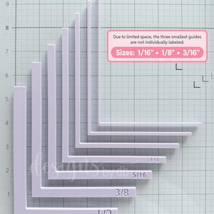 May include: A set of eight L-shaped white plastic guides arranged by size on a grid. The guides are labeled with fractions: 1/2, 3/8, 5/16, and 1/4. A pink text box states: Due to limited space, the three smallest guides are not individually labeled. Sizes: 1/16" • 1/8" • 3/16".