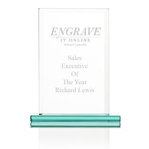 May include: A green glass award plaque with the text "ENGRAVE IT ONLINE" and "With us it's personal."  The plaque reads "Sales Executive Of The Year Richard Lewis".
