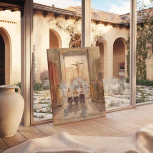 May include: A framed watercolor painting depicting a religious procession with figures in robes and a crucifix. The artwork is displayed on a wooden surface, with a large vase and a window overlooking a courtyard in the background.