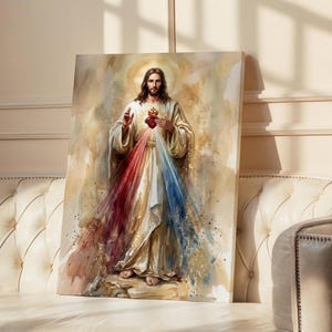 May include: Watercolor painting of a religious figure with long brown hair, wearing a white robe with red, white, and blue light emanating from the chest. The artwork is displayed on a canvas leaning against a wall.