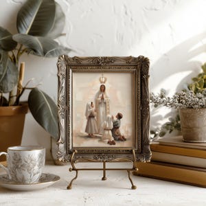 May include: A rectangular framed print featuring a central figure in white robes with a crown, surrounded by three children in prayer. The ornate, metallic-toned frame rests on a gold-colored metal easel stand, displaying a religious scene.