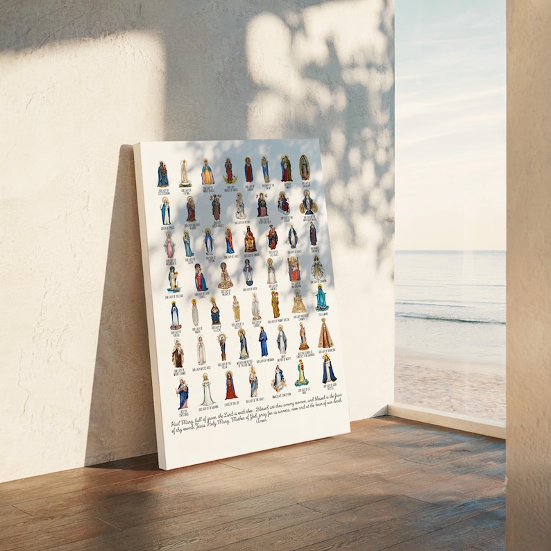 May include: A white canvas print featuring numerous illustrations of religious figures. The figures are depicted in various colors and styles, with detailed clothing and accessories. The print is leaning against a wall, with a window and ocean view in the background.