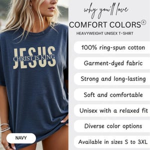 The image is a promotional image for a navy blue t-shirt with the text "JESUS" printed on it. The t-shirt is described as a "HEAVYWEIGHT UNIEX T-SHIRT" and is available in sizes S to 3XL. The image also highlights the t-shirt's features, such as 100% ring-spun cotton, 100% ring-spun cotton, and a relaxed fit.