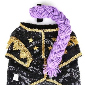May include: A black sequined pet costume with gold trim, fringe, and star accents. A purple braided yarn piece is attached to the costume. The text "ICECREAMTREE STUDIO" is visible on the bottom of the costume.