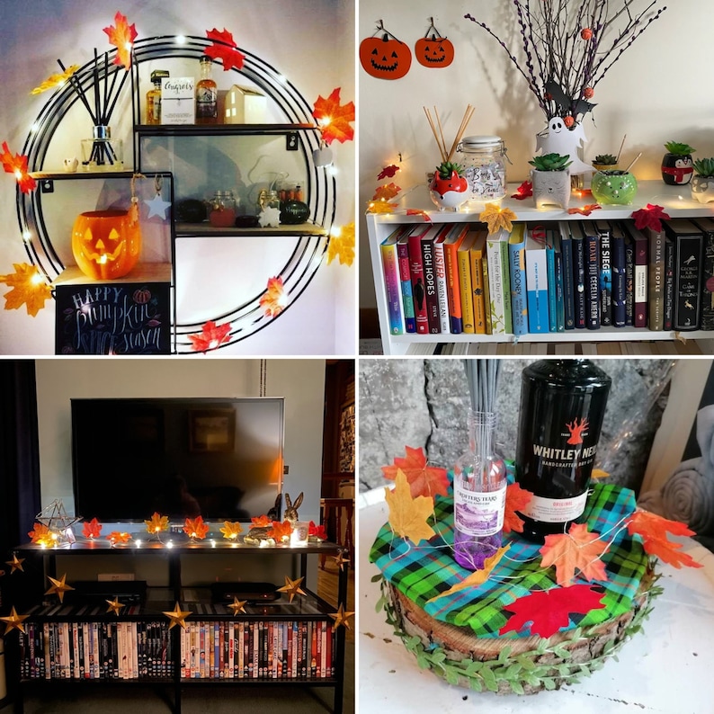 May include: A Halloween-themed home decor scene with a variety of fall foliage, pumpkins, and string lights. The scene includes a shelf with a pumpkin, a sign that says "Happy Pumpkin Season", and a variety of fall leaves. There is also a bookshelf with a variety of books, and a table with a bottle of liquor, a diffuser, and a variety of fall leaves.