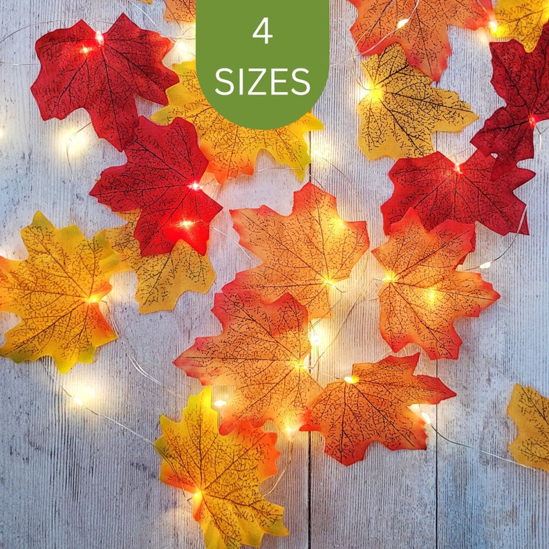 Autumn leaf fairy lights on a rustic wooden background