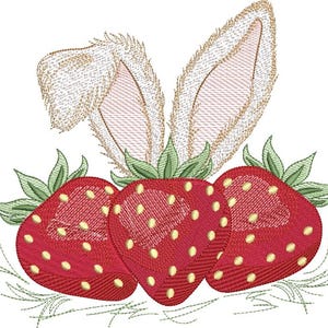 May include: Embroidered design of three red strawberries with green leaves and bunny ears. The strawberries have yellow seeds and are arranged below the tan and white bunny ears, set against a white background.