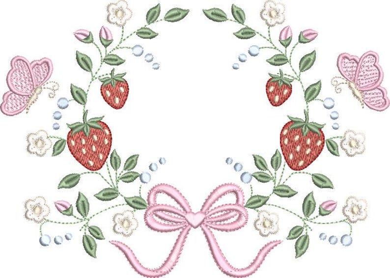 May include: Embroidered design featuring a wreath of strawberries, leaves, and flowers. Two pink butterflies and a pink bow are also included in the design. The strawberries are red with white seeds. The design is on a white background.