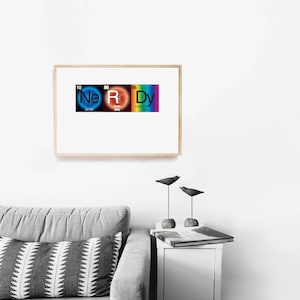 May include: A framed print with a rainbow color scheme featuring the chemical elements Neon, Rhodium, and Dysprosium, spelled out as "Nerdy".