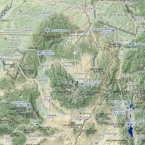 May include: A detailed topographic map of a mountainous region, featuring rivers, lakes, and labeled peaks. Key locations like Baker City and La Grande are visible, with elevation data in feet.