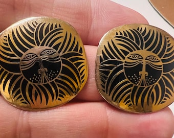 Vintage Laurel Burch "Eskimo Lion" gold-plated cloisonné earrings with black enamel.