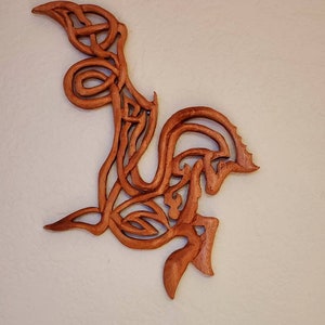 The Celtic Seahorse is handcarved in mahogany and to many is a symbol of strength and power.