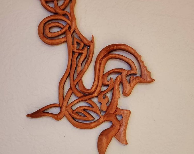 The Celtic Seahorse is handcarved in mahogany and to many is a symbol of strength and power.