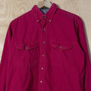 May include: A set of three ceramic mugs with a speckled, matte finish. Each mug features a different color: light blue, cream, and gray. The mugs have a simple, modern design and a comfortable handle.