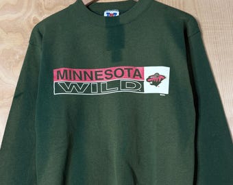 Sudadera vintage de cuello redondo verde con logo de Minnesota Wild descolorido, talla M.