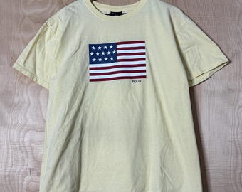 Vintage 90s Polo Sport Ralph Lauren USA Flag Graphic Yellow Cotton T Shirt size Large
