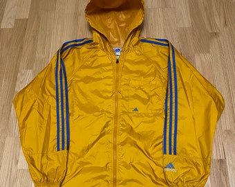 black adidas jacket with yellow stripes