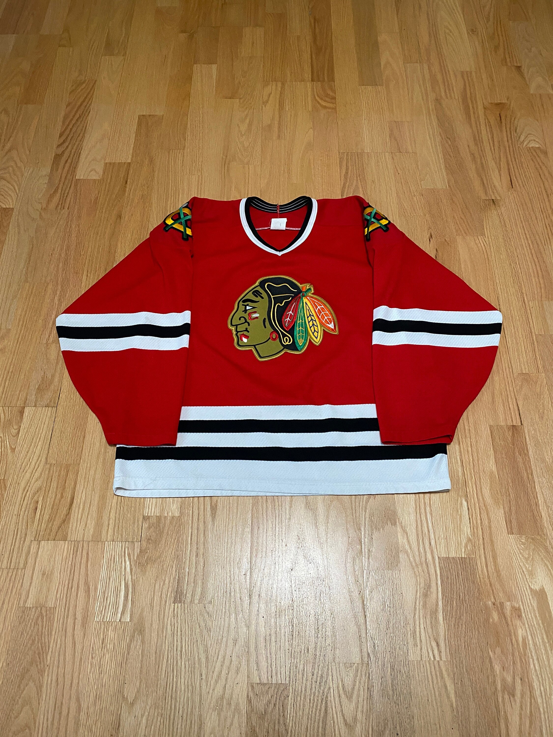 Custom Hockey Jerseys with a Blackhawk Logo and Shoulder Patches – Tally Hockey  Jerseys