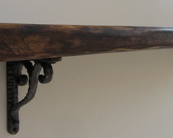 Rustic reclaimed plank wood shelf with solid cast iron brackets