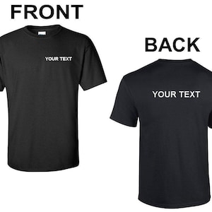 May include: Black t-shirt with short sleeves and a crew neck. The front of the shirt has the text "YOUR TEXT" printed in white. The back of the shirt has the same text printed in white.
