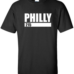 May include: Black t-shirt with white text that says "PHILLY 215"