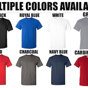 May include: A selection of t-shirts in various colors, including black, royal blue, white, gray, red, charcoal, navy blue, and cardinal red.  The t-shirts are all short-sleeved and have a crew neck.