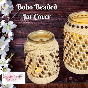 May include: Two glass jar covers with a boho design. The covers are made of cream-coloured crochet with brown beads. One jar cover has a bow. The text "Boho Beaded Jar Cover" is at the top. The text "Live Love Crochet SHAZ" is at the bottom.