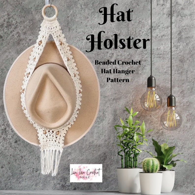 Hat Holster a Beaded Crochet Hat Hanger hanging on a wall with a hat in it with lights and plants