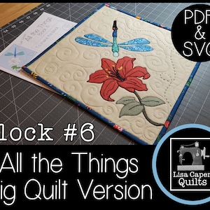 May include: Block #6 of the "All the Things" quilt pattern, featuring a red lily and a blue dragonfly embroidered on a cream-colored fabric. The block is surrounded by a blue border and is on a black grid background. The text "PDF & SVG" is in a white circle with a black border. The text "Lisa Capen Quilts" is in a white circle with a blue border and a sewing machine graphic.