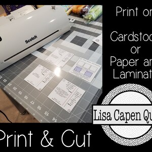 May include: A white laminator with the word "Scotch" printed on it. The laminator is on a grey cutting mat with several printed cards. The text "Print on Cardstock or Paper and Laminate" is in the top right corner of the image. The text "Lisa Capen Quilts" is in a circle with a dotted border in the bottom right corner of the image. The text "Print & Cut" is in the bottom left corner of the image.