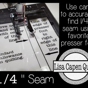 May include: A close-up of a sewing machine needle positioned over a white fabric with a printed guide for sewing a 1/4 inch seam. The guide says "Line up edge of presser foot to right edge of this line". The text "Use card to accurately find 1/4" seam using favourite presser foot" is printed in black on a white background. The text "Lisa Capen Quilts" is printed in white on a black background with a circle of white dots around it.
