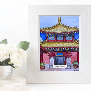 May include: A framed watercolor print of the China Pavilion. The artwork features a detailed illustration of a traditional Chinese building with a red and gold roof, blue accents, and the text "CHINA PAVILION". The print is in a white frame.