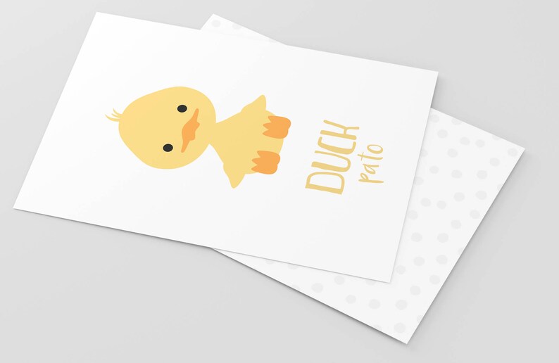 May include: A yellow duckling with orange feet and a black eye is sitting on a white background. The text "DUCH pato" is written in yellow below the duckling.