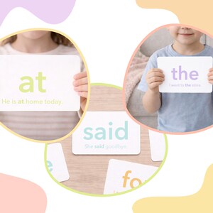 May include: Children holding flashcards with sight words. The cards display words like "at," "said," and "the" in various colors. Each card has a sentence example. Educational tools for early literacy.
