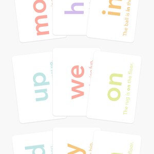 May include: Flash cards with words like "mom," "he," and "in" in various colors. The cards are white with colorful text, and some have short phrases. The Goodnight Fox logo and website are at the bottom.
